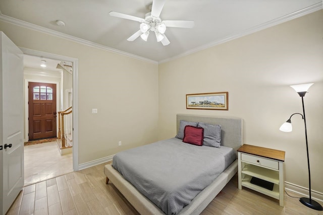 4009 Bellefontaine St, Houston, TX 77025 - bedroom featuring crown molding, wood finished floors, and a ceiling fan
