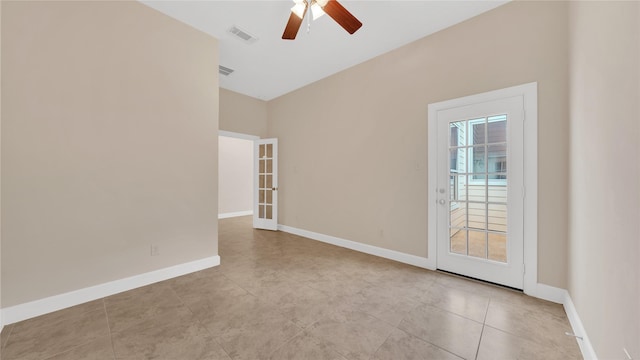 12610 Baldwin Springs Ct, Tomball, TX 77377 - tiled spare room featuring a ceiling fan and baseboards