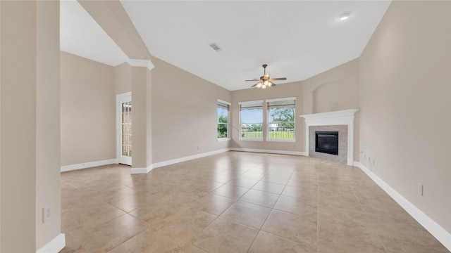 12610 Baldwin Springs Ct, Tomball, TX 77377 - unfurnished living room with ceiling fan, light tile patterned floors, and a fireplace