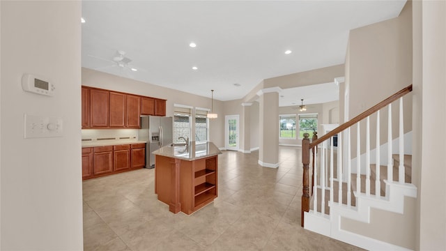 12610 Baldwin Springs Ct, Tomball, TX 77377 - kitchen with stainless steel refrigerator with ice dispenser, a ceiling fan, ornate columns, open shelves, and recessed lighting