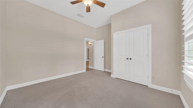 12610 Baldwin Springs Ct, Tomball, TX 77377 - unfurnished bedroom with carpet flooring, a closet, and ceiling fan