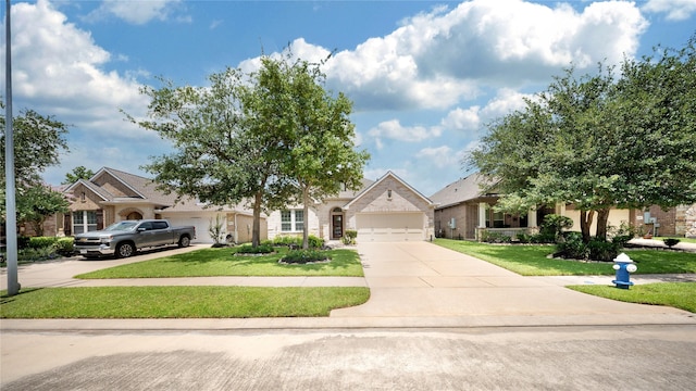 12610 Baldwin Springs Ct, Tomball, TX 77377 - view of property hidden behind natural elements with driveway, a front yard, an attached garage, and brick siding