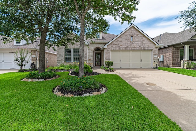12610 Baldwin Springs Ct, Tomball, TX 77377 - view of front facade with concrete driveway, a garage, a front yard, brick siding, and a shingled roof