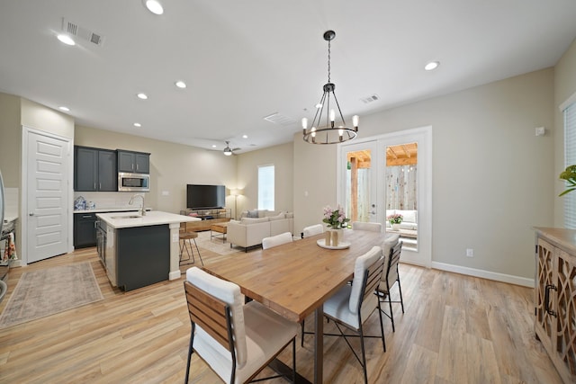 911 W 35th St Unit C, Houston, TX 77018 - dining room with a chandelier, light wood-type flooring, and recessed lighting