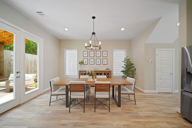 911 W 35th St Unit C, Houston, TX 77018 - dining area featuring a chandelier, healthy amount of natural light, french doors, light wood-style flooring, and recessed lighting