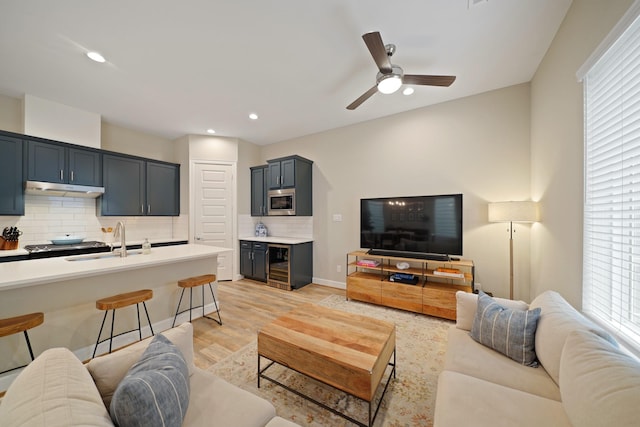 911 W 35th St Unit C, Houston, TX 77018 - living area featuring beverage cooler, light wood-type flooring, a ceiling fan, and recessed lighting