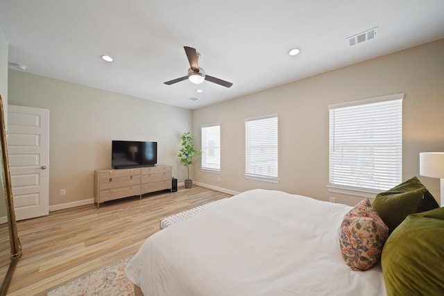 911 W 35th St Unit C, Houston, TX 77018 - bedroom with light wood-style floors, a ceiling fan, and recessed lighting