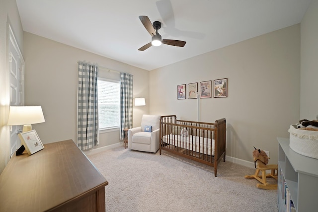 911 W 35th St Unit C, Houston, TX 77018 - bedroom with carpet floors, a ceiling fan, and a crib