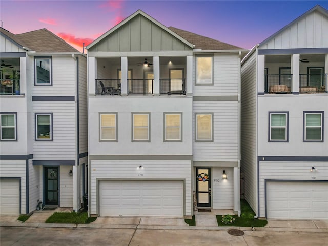 911 W 35th St Unit C, Houston, TX 77018 - modern home featuring concrete driveway, an attached garage, board and batten siding, roof with shingles, and a balcony
