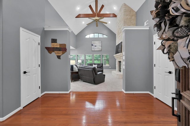 11304 Monarchs Way, Montgomery, TX 77316 - foyer featuring high vaulted ceiling, ceiling fan, wood finished floors, a stone fireplace, and recessed lighting