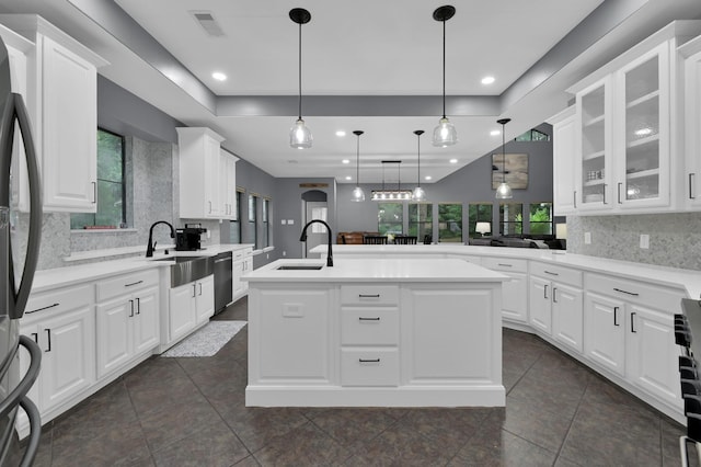 11304 Monarchs Way, Montgomery, TX 77316 - kitchen featuring tasteful backsplash, stainless steel appliances, glass insert cabinets, white cabinets, and recessed lighting
