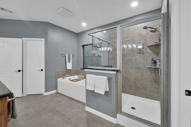 11304 Monarchs Way, Montgomery, TX 77316 - bathroom featuring a garden tub, a stall shower, tile patterned floors, and vanity
