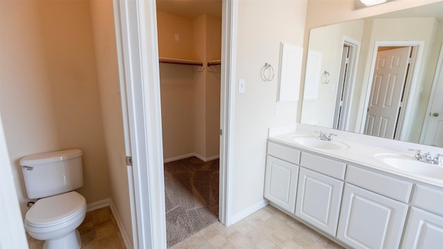 14911 Calico Heights Ln, Cypress, TX 77429 - bathroom featuring double vanity, a walk in closet, and tile patterned floors