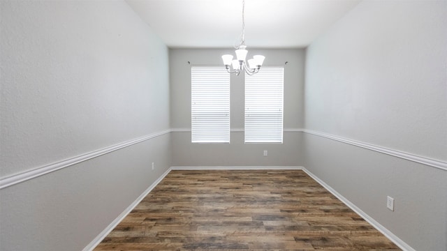 14911 Calico Heights Ln, Cypress, TX 77429 - unfurnished room featuring a chandelier and dark wood-style floors