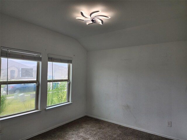 20390 Tembec Dr, New Caney, TX 77357 - spare room featuring lofted ceiling and carpet flooring