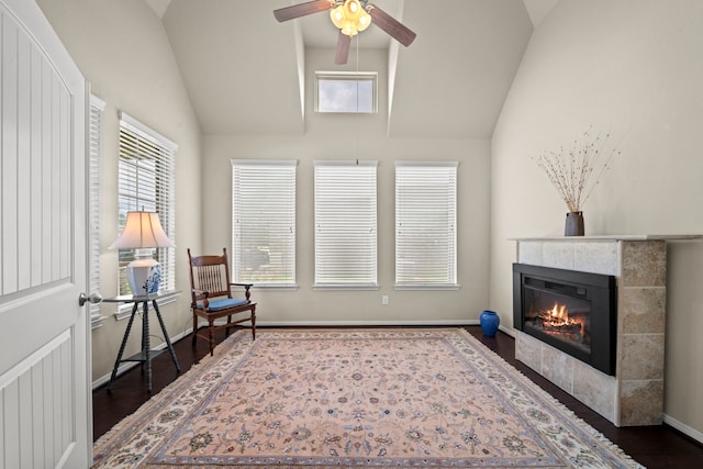 22607 Ebbets Field Dr, Spring, TX 77389 - sitting room with lofted ceiling, a tiled fireplace, wood finished floors, and ceiling fan