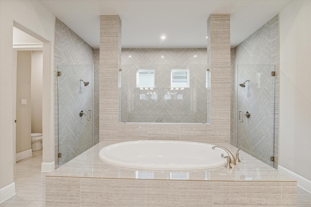 3954 Kelley Pond Dr, Spring, TX 77386 - bathroom featuring a bath, a shower stall, and tile patterned floors