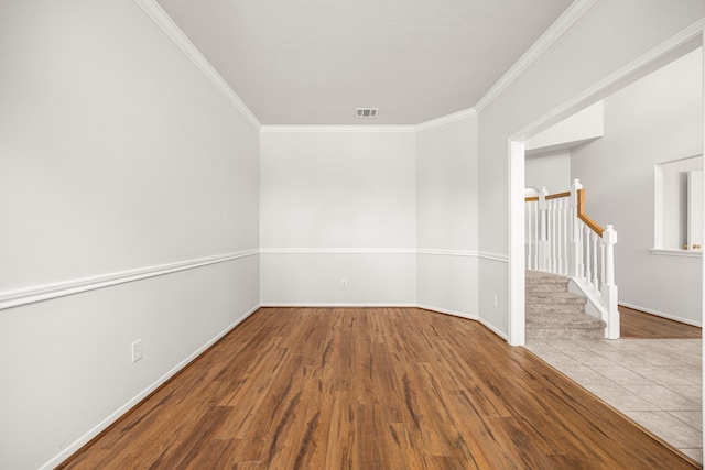 2722 Round Hill Ct, Katy, TX 77494 - unfurnished room featuring crown molding, wood finished floors, and stairs
