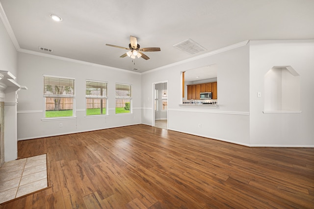 2722 Round Hill Ct, Katy, TX 77494 - unfurnished living room with ceiling fan, wood finished floors, and ornamental molding