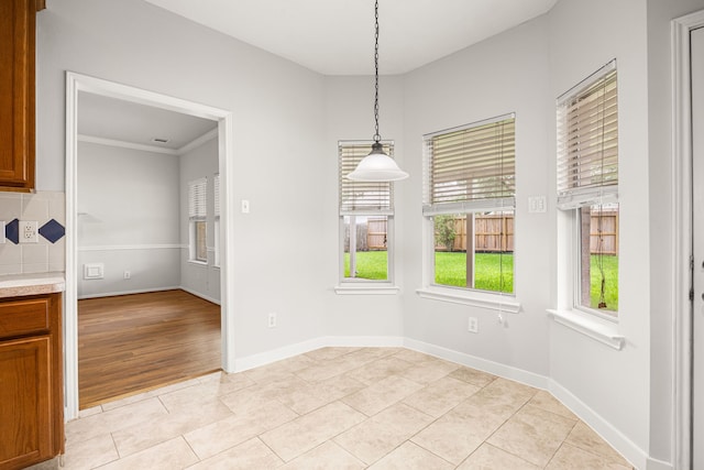 2722 Round Hill Ct, Katy, TX 77494 - unfurnished dining area with light tile patterned floors and crown molding