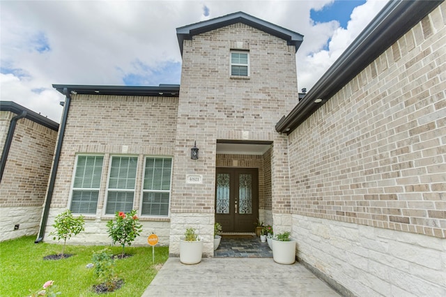 4821 1st St, Houston, TX 77504 - view of exterior entry featuring french doors and brick siding