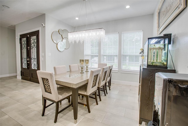 4821 1st St, Houston, TX 77504 - dining area featuring a chandelier, light tile patterned floors, french doors, and recessed lighting