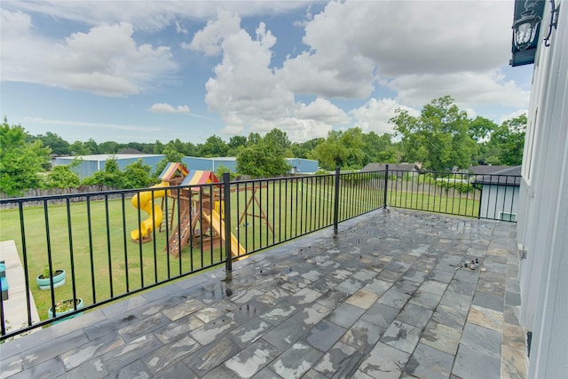4821 1st St, Houston, TX 77504 - fenced backyard featuring a playground and a patio area