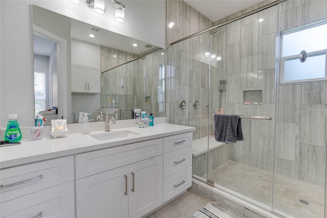 4821 1st St, Houston, TX 77504 - bathroom with a stall shower, vanity, plenty of natural light, and tile patterned flooring