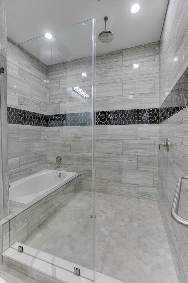 4821 1st St, Houston, TX 77504 - bathroom with a tile shower, tile patterned floors, a bath, and recessed lighting