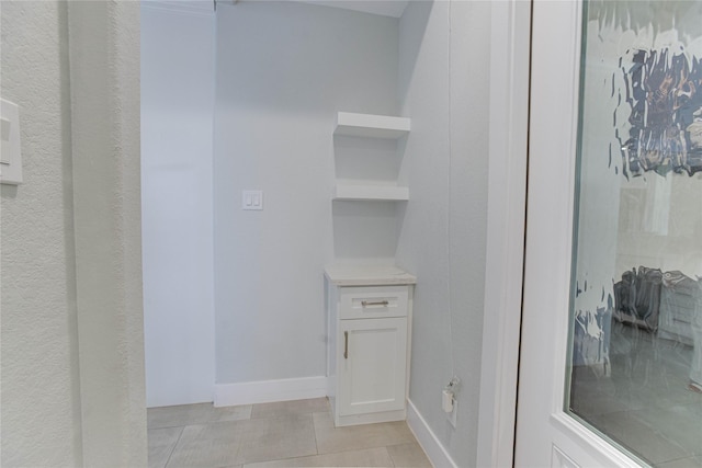 4821 1st St, Houston, TX 77504 - bathroom featuring baseboards and tile patterned flooring