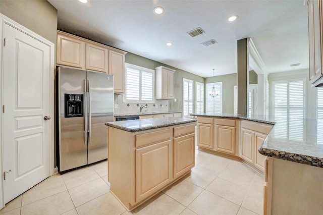 13212 Lismore Pt, Cypress, TX 77429 - kitchen featuring stainless steel refrigerator with ice dispenser, light brown cabinetry, a peninsula, dark stone countertops, and recessed lighting