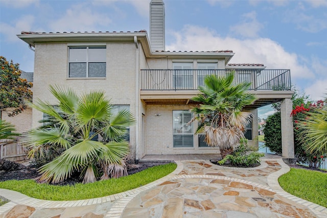 13212 Lismore Pt, Cypress, TX 77429 - rear view of property with brick siding, a chimney, and a balcony