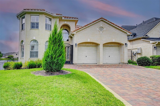 13212 Lismore Pt, Cypress, TX 77429 - mediterranean / spanish-style house featuring decorative driveway, an attached garage, and a tile roof