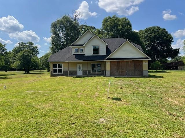 6985 Ellen Ln, Beaumont, TX 77708 - view of front facade with a front lawn