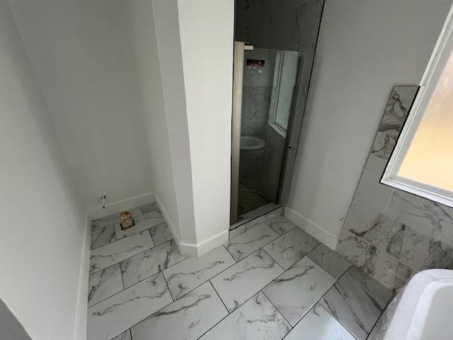 6985 Ellen Ln, Beaumont, TX 77708 - full bath featuring marble finish flooring, a tub to relax in, and a stall shower