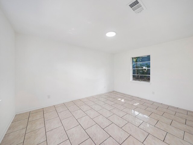 9101/2 Oak St, Houston, TX 77018 - spare room with light tile patterned flooring
