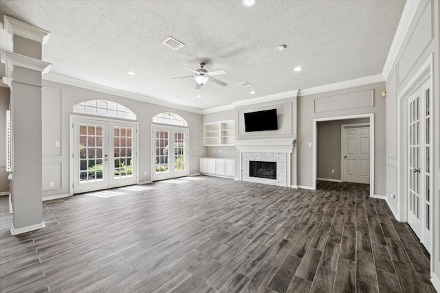 15814 Hillside Falls Trl, Houston, TX 77062 - unfurnished living room with french doors, a ceiling fan, crown molding, dark wood-type flooring, and a textured ceiling