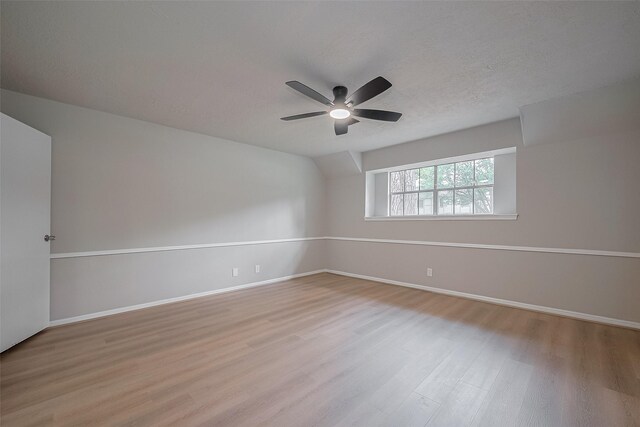 12611 Campsite Trl, Cypress, TX 77429 - spare room with wood finished floors, a ceiling fan, and a textured ceiling