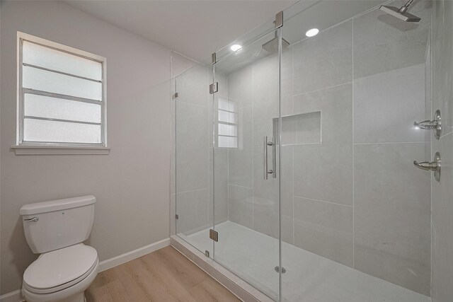 12611 Campsite Trl, Cypress, TX 77429 - bathroom featuring wood finished floors and a shower stall