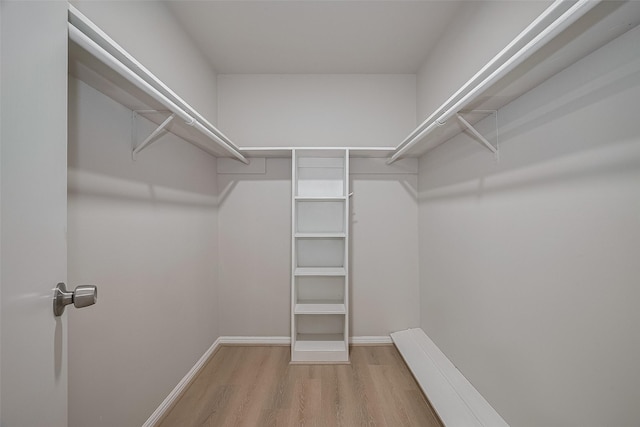 12611 Campsite Trl, Cypress, TX 77429 - walk in closet featuring wood finished floors