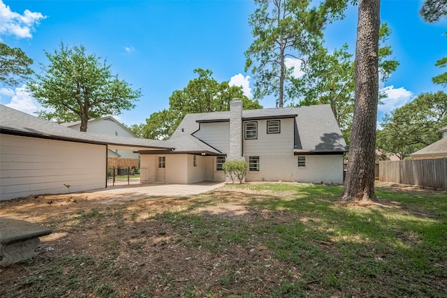 12611 Campsite Trl, Cypress, TX 77429 - rear view of property featuring brick siding, a patio area, and a chimney