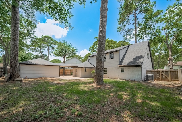 12611 Campsite Trl, Cypress, TX 77429 - back of property with brick siding, a patio, and a gate