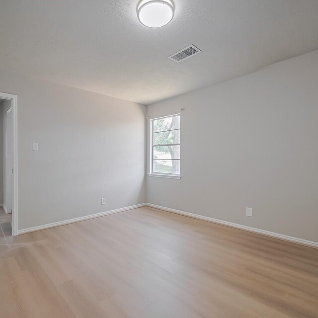 12611 Campsite Trl, Cypress, TX 77429 - spare room featuring light wood-type flooring and baseboards