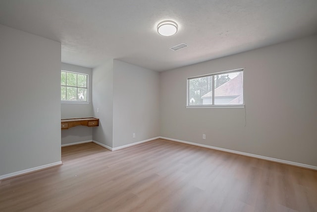 12611 Campsite Trl, Cypress, TX 77429 - spare room with wood finished floors and baseboards
