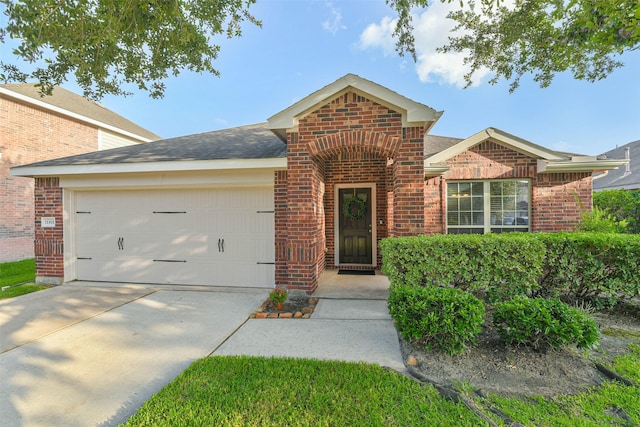 11410 Sandstone Canyon Dr, Humble, TX 77396 - traditional home featuring brick siding, an attached garage, driveway, and a shingled roof