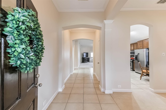 11410 Sandstone Canyon Dr, Humble, TX 77396 - hallway with arched walkways, light tile patterned floors, and crown molding