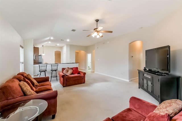 11410 Sandstone Canyon Dr, Humble, TX 77396 - living room with arched walkways, light colored carpet, a ceiling fan, and recessed lighting