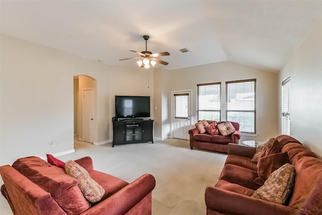 11410 Sandstone Canyon Dr, Humble, TX 77396 - living area with arched walkways, ceiling fan, light carpet, and lofted ceiling