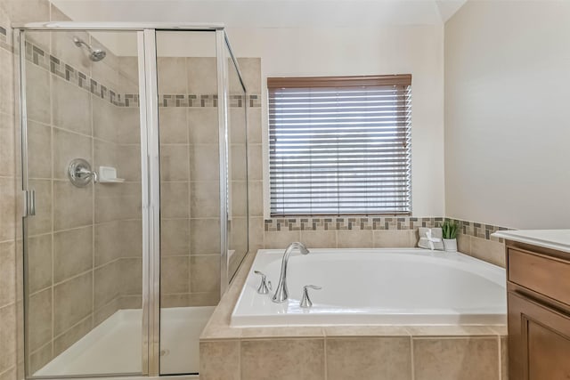 11410 Sandstone Canyon Dr, Humble, TX 77396 - bathroom featuring vanity, a bath, and a shower stall