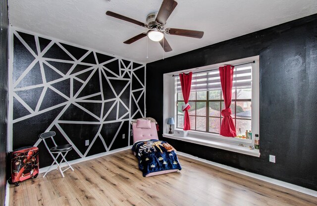 7826 Granite Ridge Ln, Houston, TX 77095 - sitting room featuring wood finished floors and a ceiling fan